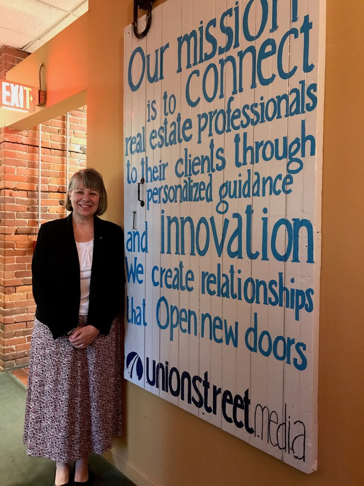 woman standing in front of union street media's mission statement