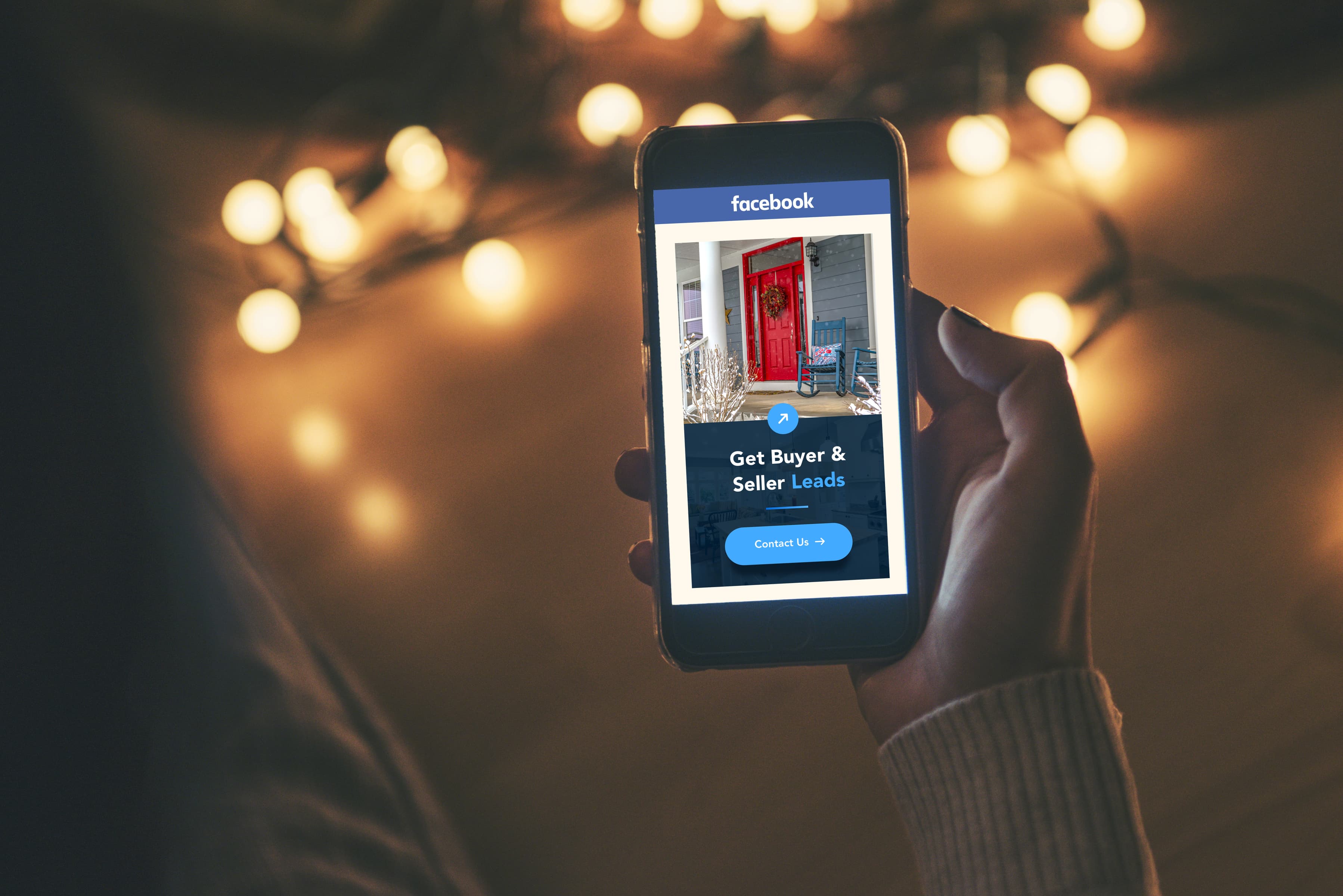 Person Holding Mobile Phone with Advertisment showing a home with a red door