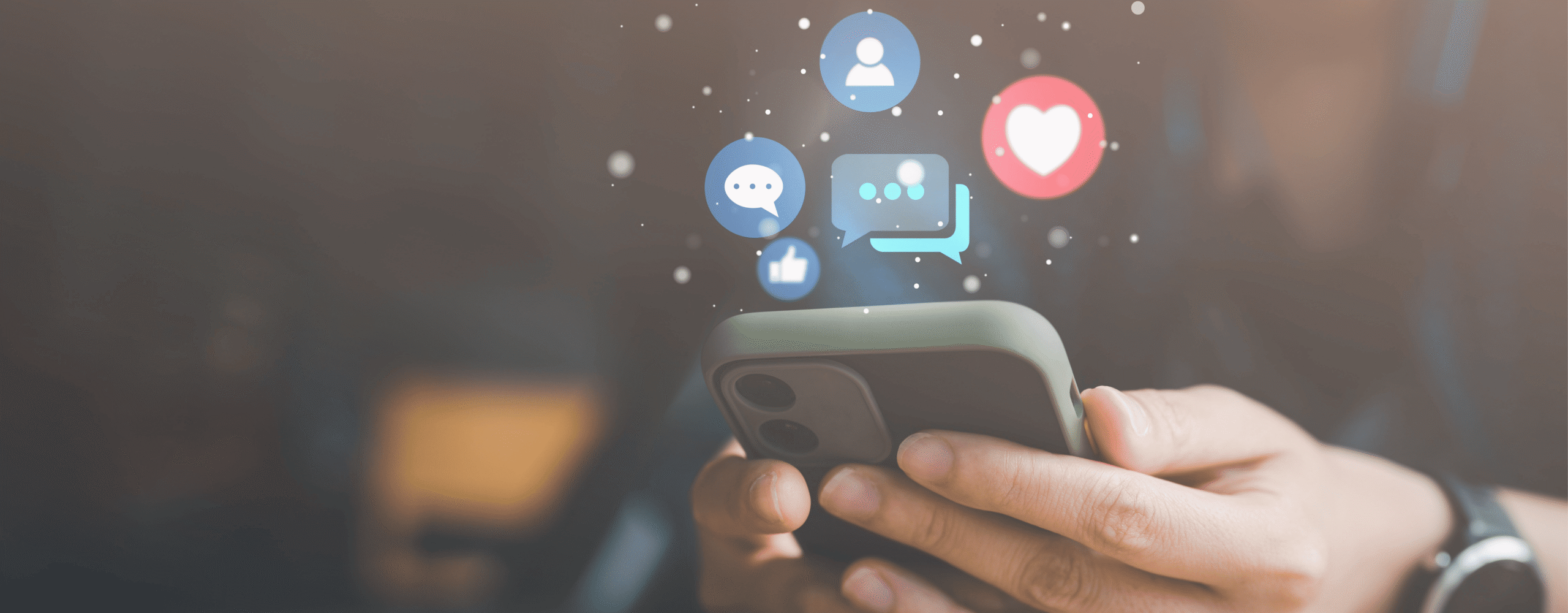 person holding phone with social media optimization icons