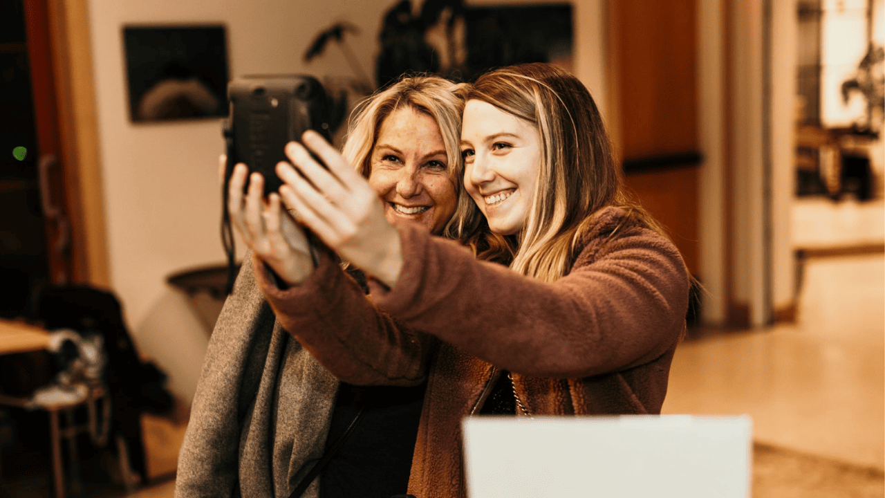 two people taking a photo