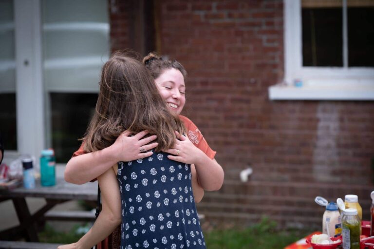 two women hugging union street media celebrating international womens day 2022
