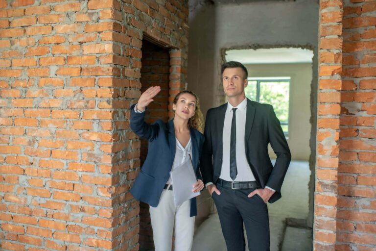 real estate agent showing real estate investor a property
