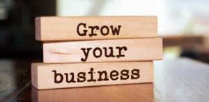 grow your business written on stacked wood blocks